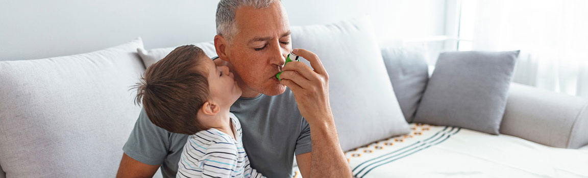 An elderly person is using an inhaler device to improve living conditions